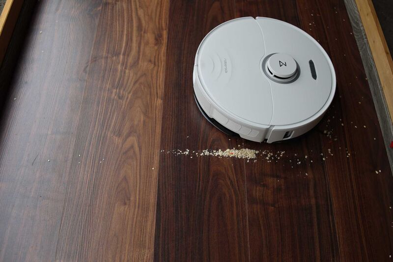 Vacuuming oat flakes on hard floor